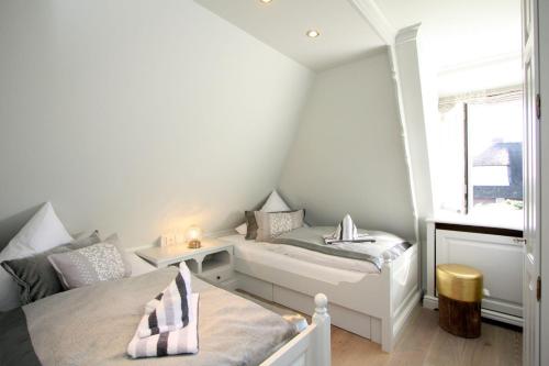Llit o llits en una habitació de Rosenhaus unter Reet