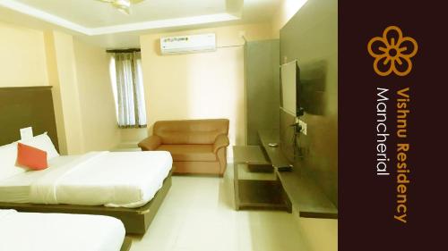 a hotel room with two beds and a chair at Vishnu Residency Mancherial in Mancherāl