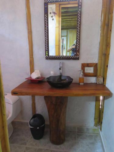 a bathroom with a sink and a mirror at Tatacoa Star Eco Hotel in Villavieja