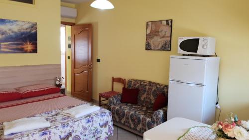 Ένα ή περισσότερα κρεβάτια σε δωμάτιο στο casa Bianca al mare