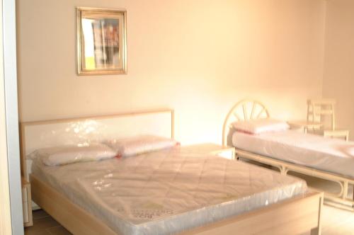 una camera con 2 letti di Casa Maculan a Villaverla