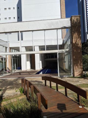 a wooden bench sitting in front of a building at Maximus Luxury in NYC Berrini in Sao Paulo