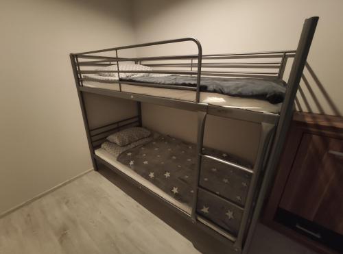 a couple of bunk beds in a room at Apartament przy rynku in Duszniki Zdrój