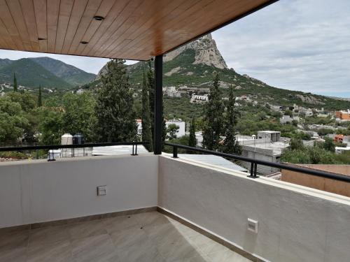 a balcony with a view of a mountain at Hotel la Cuesta Toscana in Bernal