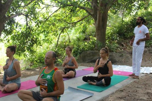 a group of people sitting in a yoga class at Cham Island Smiles Homestay in Tân Hiệp