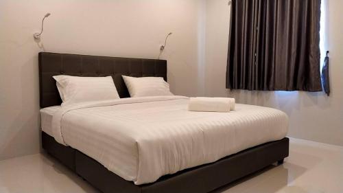 Postel nebo postele na pokoji v ubytování Suwannolhotel