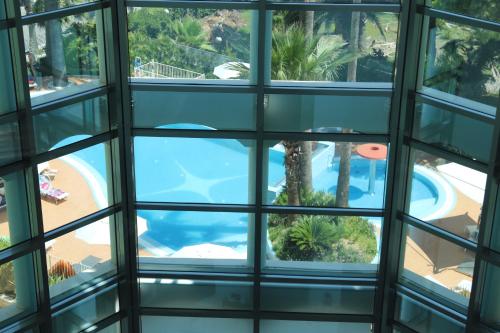 a view from the window of a building with a swimming pool at Smeraldo Suites & Spa in San Benedetto del Tronto