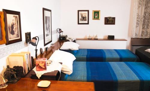 מיטה או מיטות בחדר ב-B&B Villa Sorriso