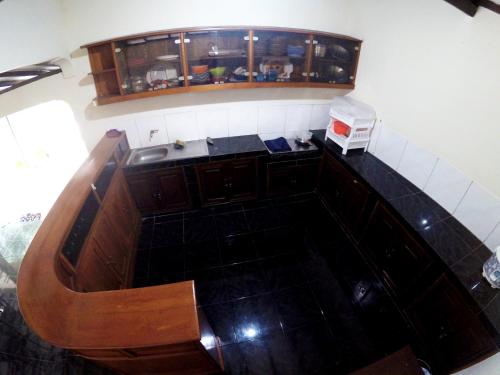 an overhead view of a kitchen with a sink at Garden Yard Homestay Jogja in Ngaglik
