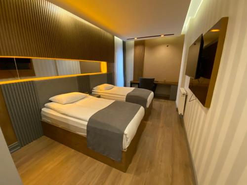 Katil atau katil-katil dalam bilik di Sarıkamış Aras Otel