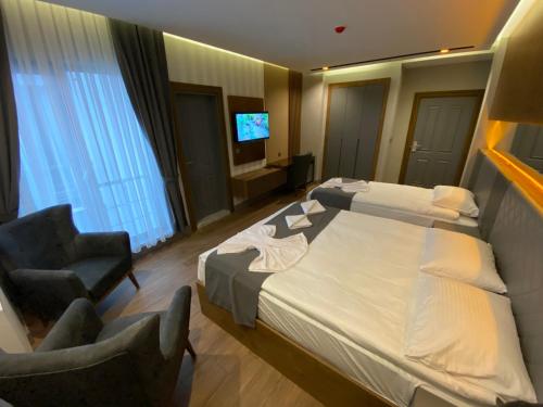 Katil atau katil-katil dalam bilik di Sarıkamış Aras Otel