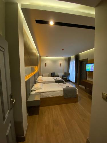 Katil atau katil-katil dalam bilik di Sarıkamış Aras Otel