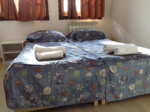 a bedroom with a bed with two pillows on it at Apartment Nice View in Fojnica