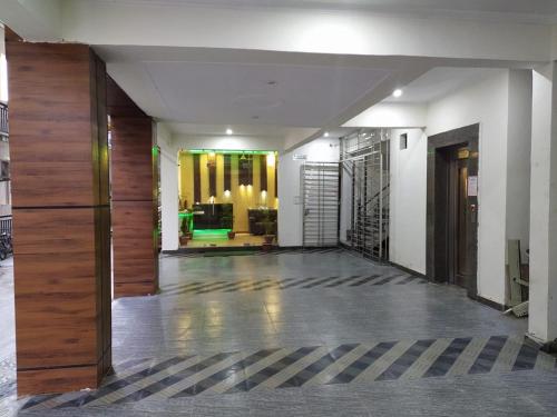a hallway of a building with a room at Hotel The Shivaay - Delight Inn Rishikesh in Rishīkesh