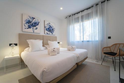 Een bed of bedden in een kamer bij Estepona Holiday Hills
