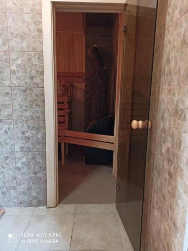 a glass door to a closet with a closet at Relax villa Poduzska in Sinyak