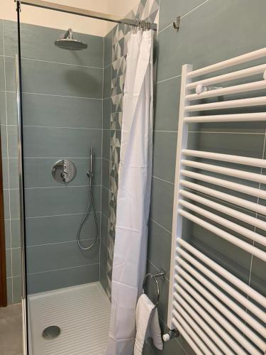 a shower with a glass door in a bathroom at Casa Cristina in Bolsena
