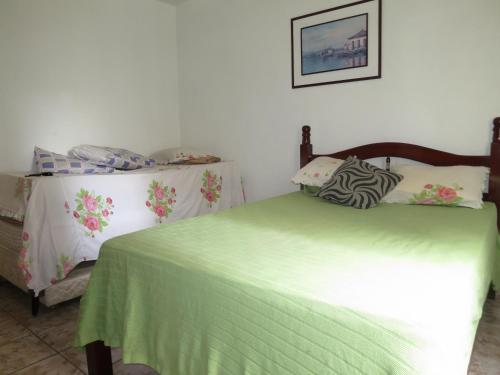 Кровать или кровати в номере Apto Canto do Forte - Praia Grande - Local Privilegiado - 100 metros da Praia - Internet inclusa