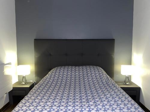 Una cama o camas en una habitación de les clos de ursulines