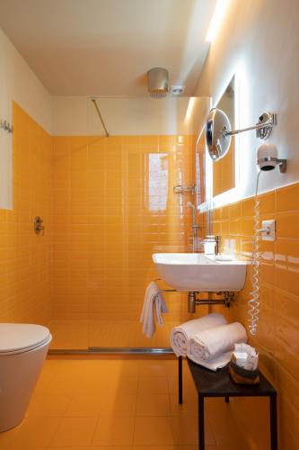 a bathroom with a sink and a toilet at Marina Piccola 73 in Sorrento