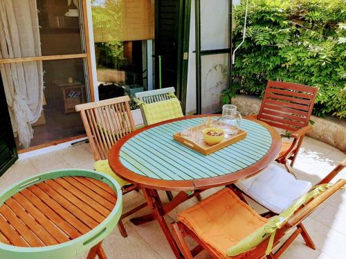 a table and chairs sitting on a patio at Holiday Home Subasic in Zlarin