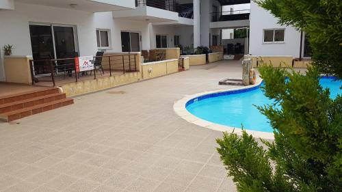 a swimming pool in the middle of a building at Dahan Sirena lighthouse Luxury Apartment in Paphos