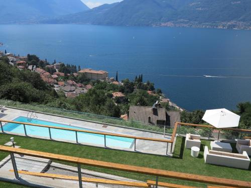 a swimming pool with a view of a lake at Spectacular views and modern living on Lake Como in Bellano