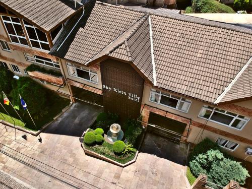 an overhead view of a house with a building at Sky Ville Hotel Canela in Canela
