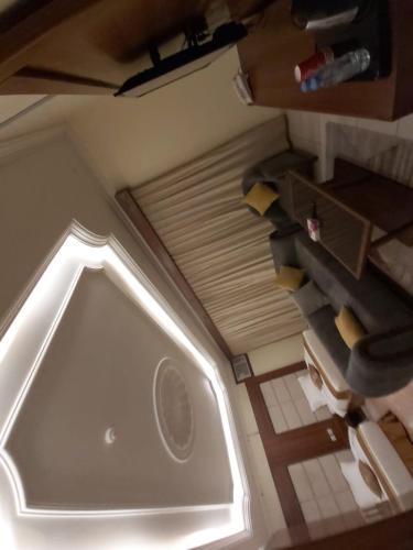 an overhead view of a bathroom with a toilet at Reef Al-Hijrah Furnished Apartments in Al Madinah