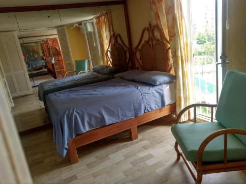 Giường trong phòng chung tại IOW4 LM Junior Suite