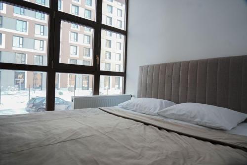 Кровать или кровати в номере Sulu Hostel