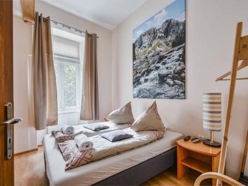 a living room with a couch in a room at Apartamenty Góralska Pasja Krupówki 37 in Zakopane