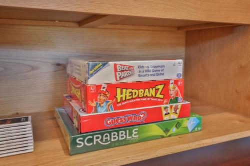a stack of childrens books on a shelf at Indulge Luxury Homes - Dockside Marina in Mildura
