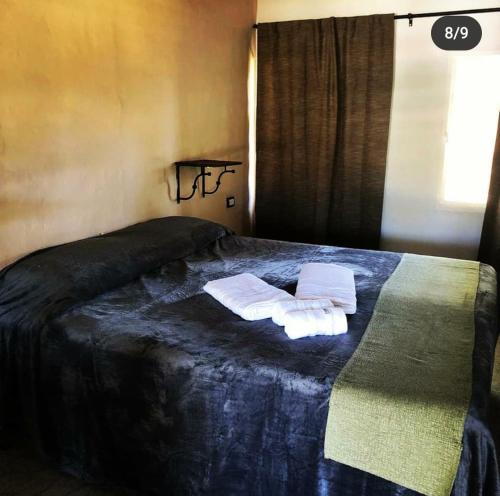 Säng eller sängar i ett rum på POSADA EN LAS TAPIAS TRANSLASIERRAS