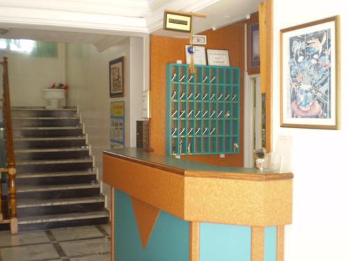 a lobby with stairs and a counter in a building at Blue Yacht Marina Apart Hotel in Marmaris