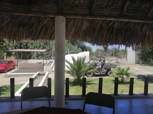 a resort with a golf cart parked in a yard at Catorce Capital A una HORA de Real de Catorce in Estación Catorce