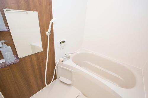 a bathroom with a white toilet in a room at ヒルトップ箱根入生田202 in Odawara