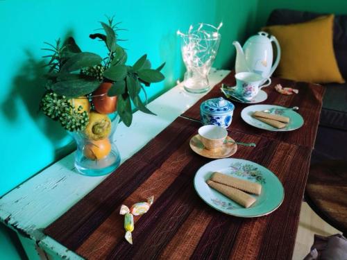 a wooden table with plates of food on top of it at Relais Villa Fiorelli in Rome