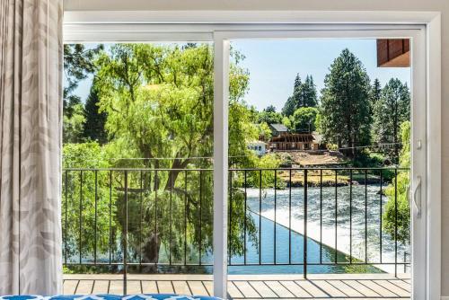 a window view of a pool from a house at Bend Riverside Condos Near Downtown Bend in Bend