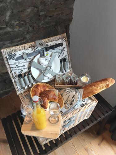 a tray of food and bread on a table at Le 30 in Troistorrents