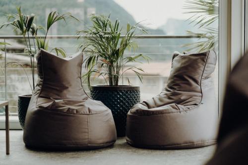 a pair of boots sitting in front of a window at Prunner Luxury Suites - Adults Only in Schenna