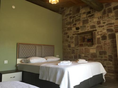 Ένα ή περισσότερα κρεβάτια σε δωμάτιο στο HAYAT ALTI OTEL ayvalık