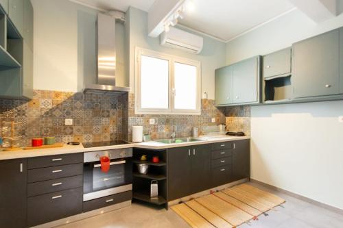 A kitchen or kitchenette at ATHENS Penthous at Center