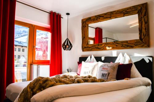 Кровать или кровати в номере Boutique Hotel Pinzgauerhof