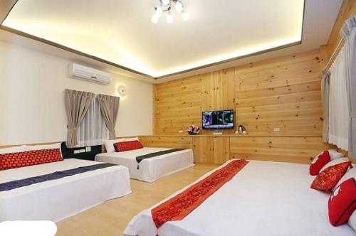 Voodi või voodid majutusasutuse Yun Cui Leisure B&B toas