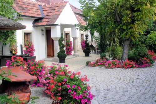 a garden of flowers in front of a house at Romantikchalet in Breitenbrunn