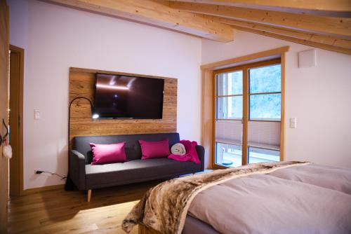 Ένα ή περισσότερα κρεβάτια σε δωμάτιο στο Leos Alpenchalet - inclusive Sommer Bergbahnticket und E-Auto Ladestation