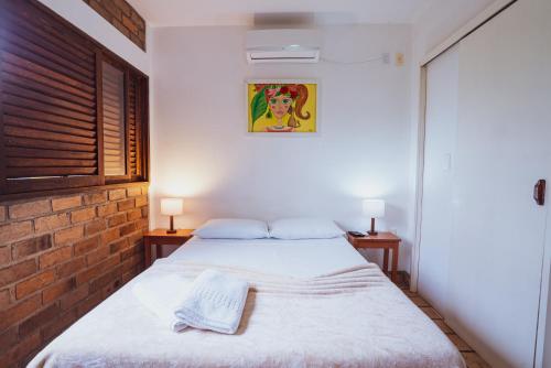 Cama ou camas em um quarto em Pousada Alto do Cajueiro