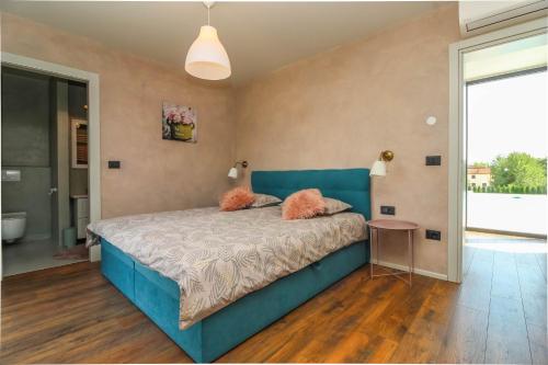 Postel nebo postele na pokoji v ubytování Villa Una Sofia