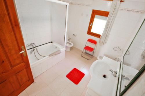 a bathroom with a shower toilet and a sink at Finca Palacios - comfortable holiday accommodation in Benissa in Benissa